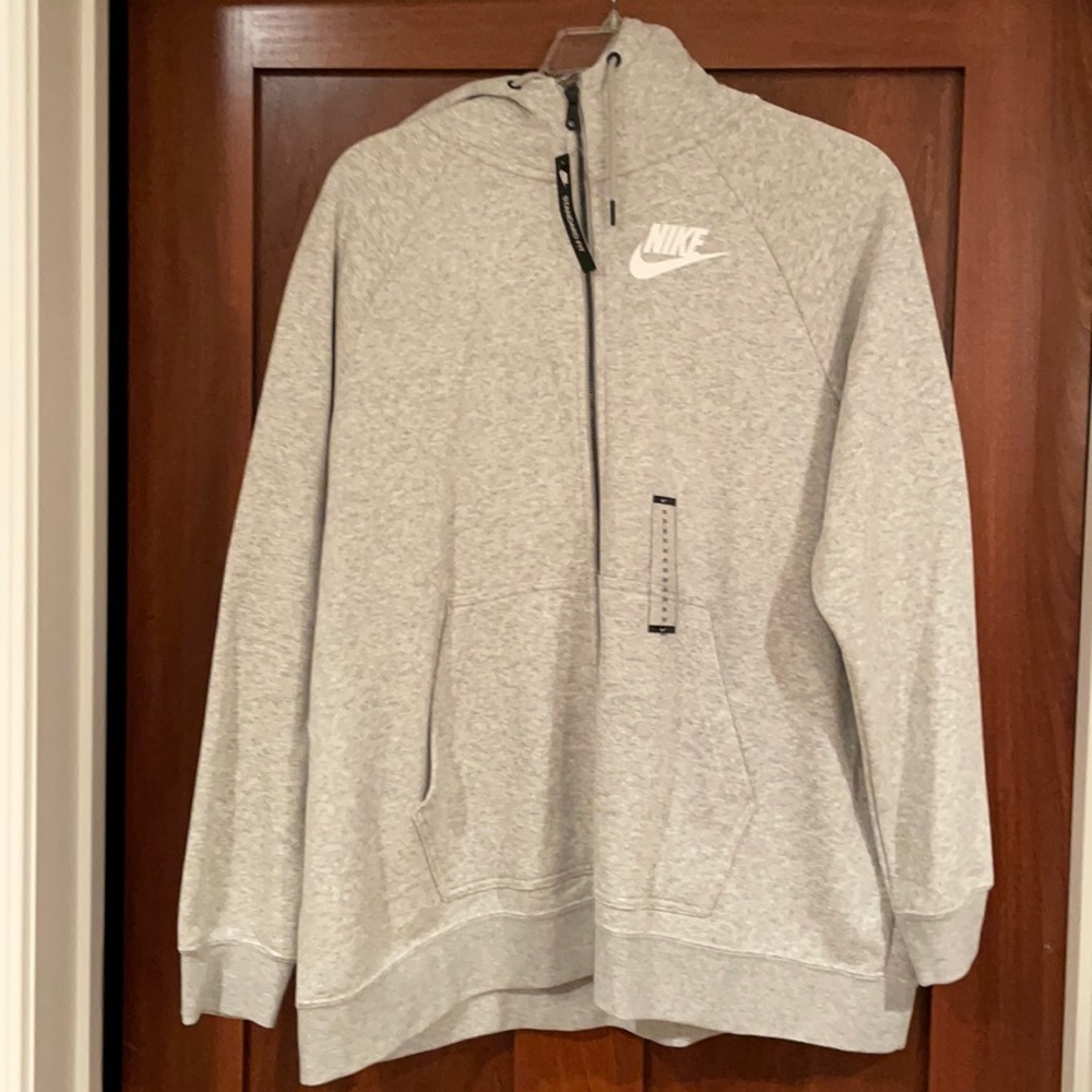 Heather gray, women’s Nike zip-up hoodie. Brand new with tags
